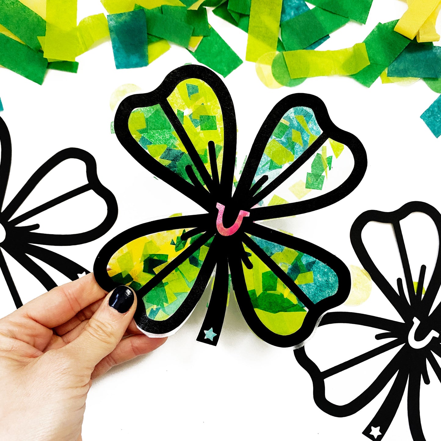 Paper shamrock craft for St. Patricks Day party.